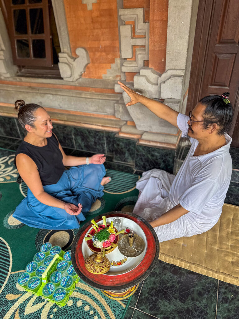 woman being blessed by shaman in bali