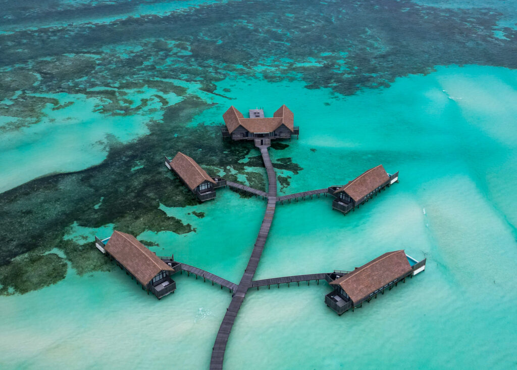 Villas over turquoise water in the maldives