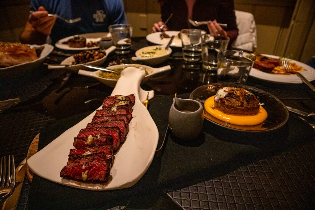 Steak and gourmet sides at dinner with friends at Park Hyatt Beaver Creek restaurant