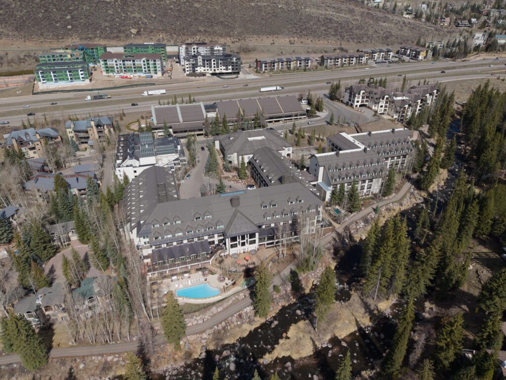 Grand Hyatt Vail ski-in ski-out resort in Cascade Village with heated pool and Gore Creek in Vail, Colorado