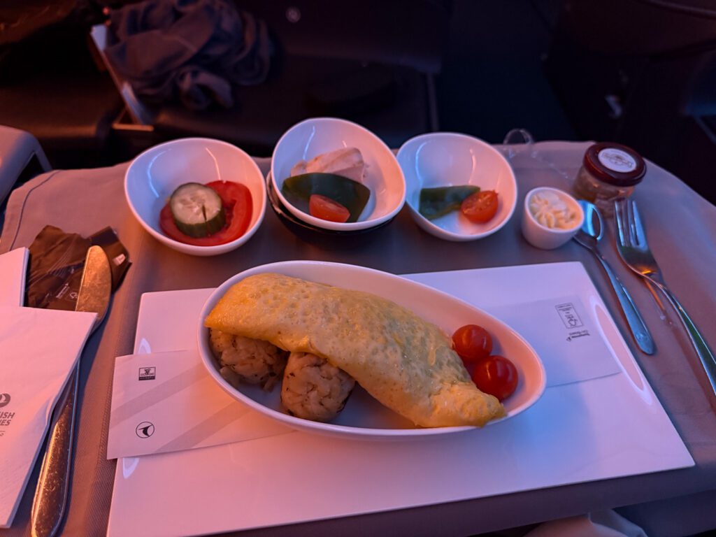 Breakfast omelette with potatoes and cherry tomatoes in Turkish Airlines business class.