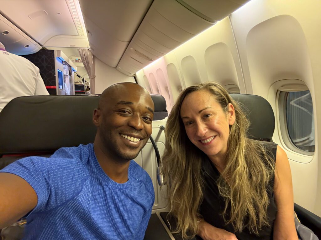 Two travelers seated together beside the windows in Turkish Airlines business class.