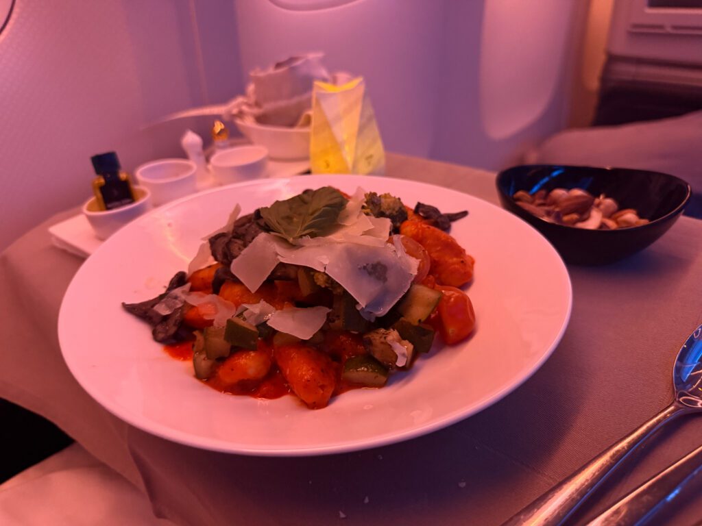 Gnocchi with mushrooms, vegetables and Parmesan served in Turkish Airlines business class.