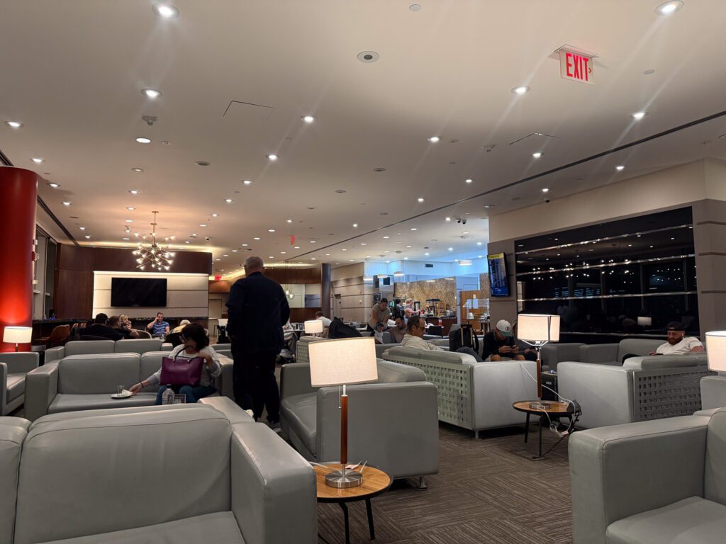 Gray armchairs, side tables and lamps inside the Turkish Airlines lounge at JFK.